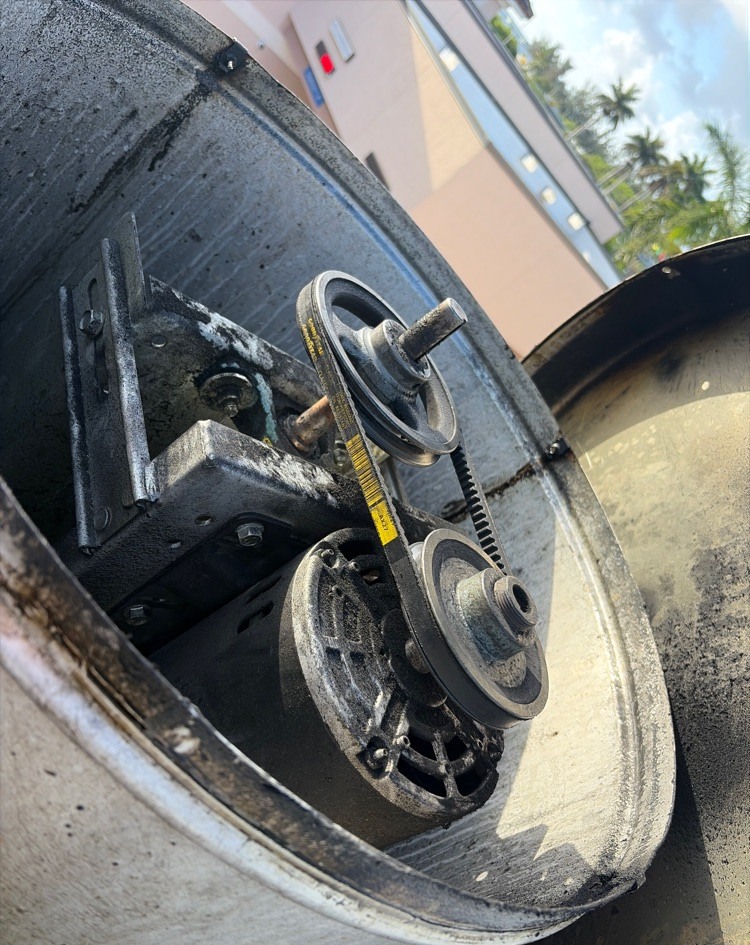New replacement belt installed on the motor and pulley assembly of the same upblast fan